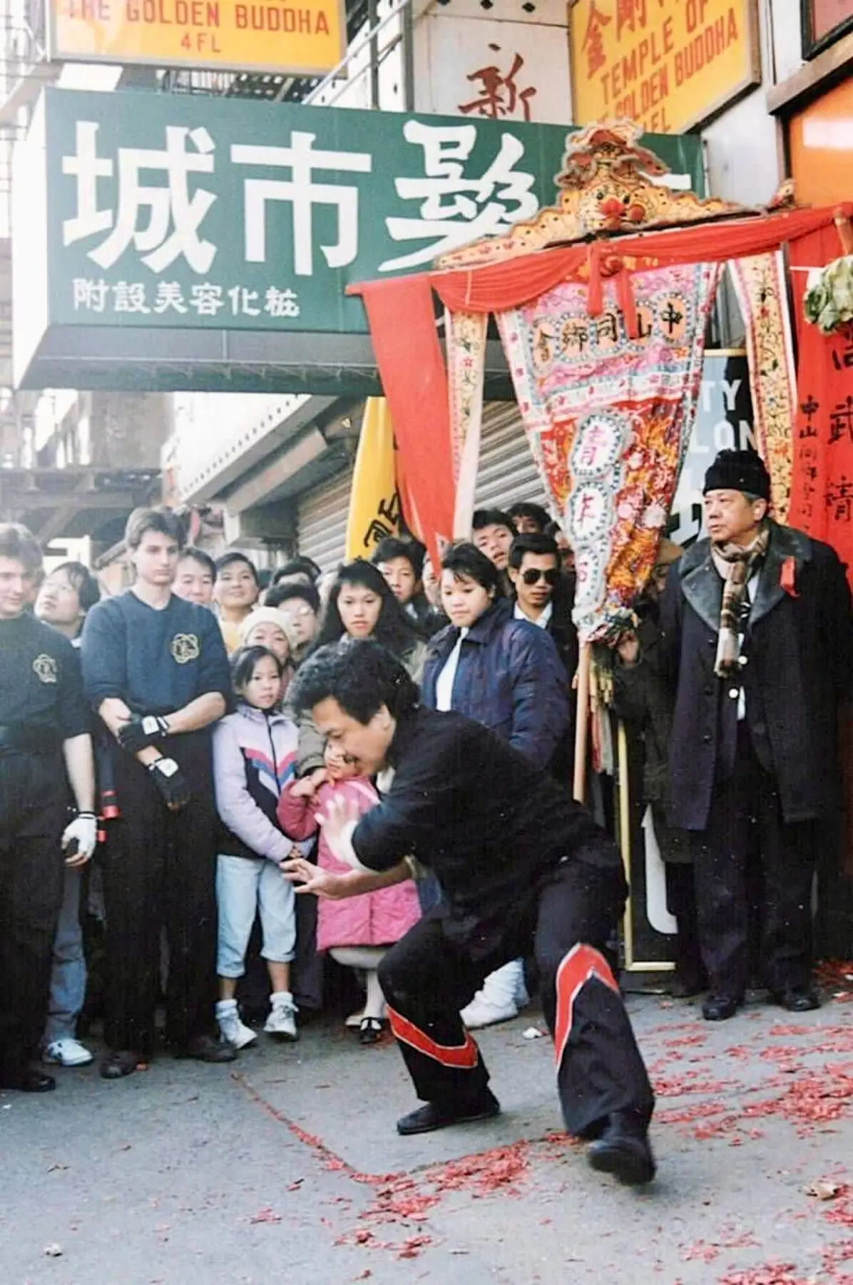 Sifu Tony Lau holding a low, rooted Hung Gar stance before a crowd